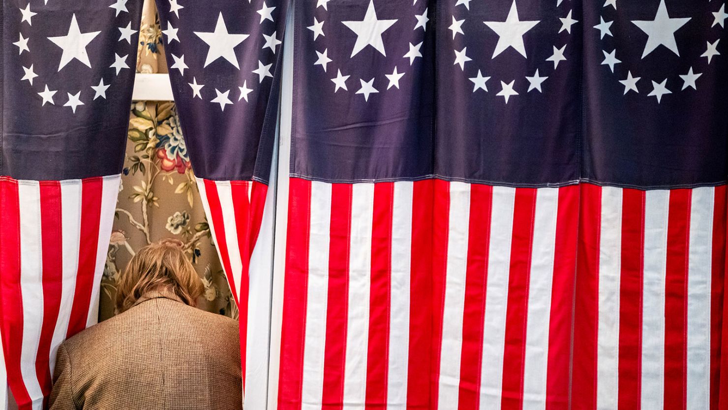 Tom Tillotson votes just after midnight during the traditional first vote of of the state's primary in Dixville Notch, New Hampshire, on January 23, 2024.
